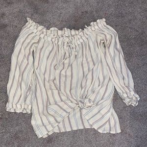 it’s a cute shirt to tie up or wear out or put over a bathing suit!